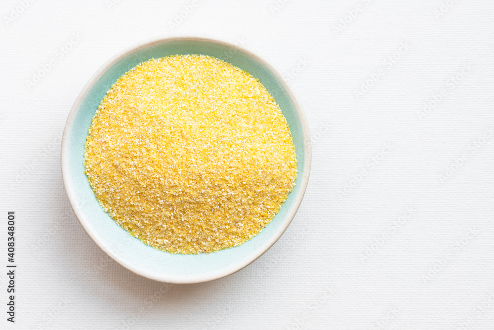 Uncooked Yellow Corn Meal in a Bowl Uncooked Yellow Corn Meal in a Bowl