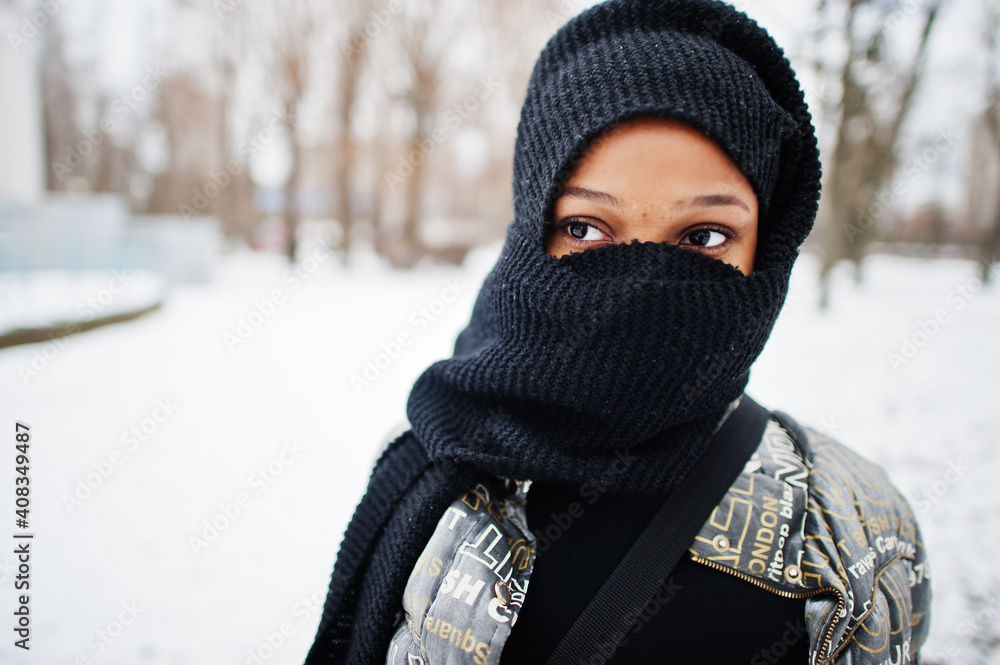 African muslim woman wear in black hijab scarf pose in winter day at Europe. African muslim woman wear in black hijab scarf pose in winter day at Europe.
