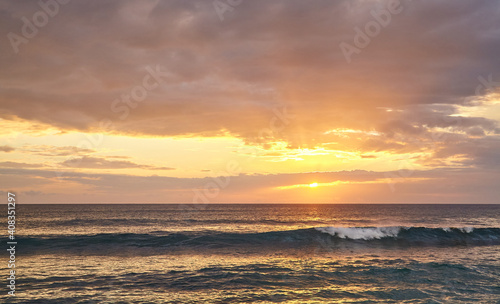 Picture of a seascape at beautiful golden sunset.
