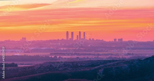 Madrid skyline and airport during sunset timelapse. photo