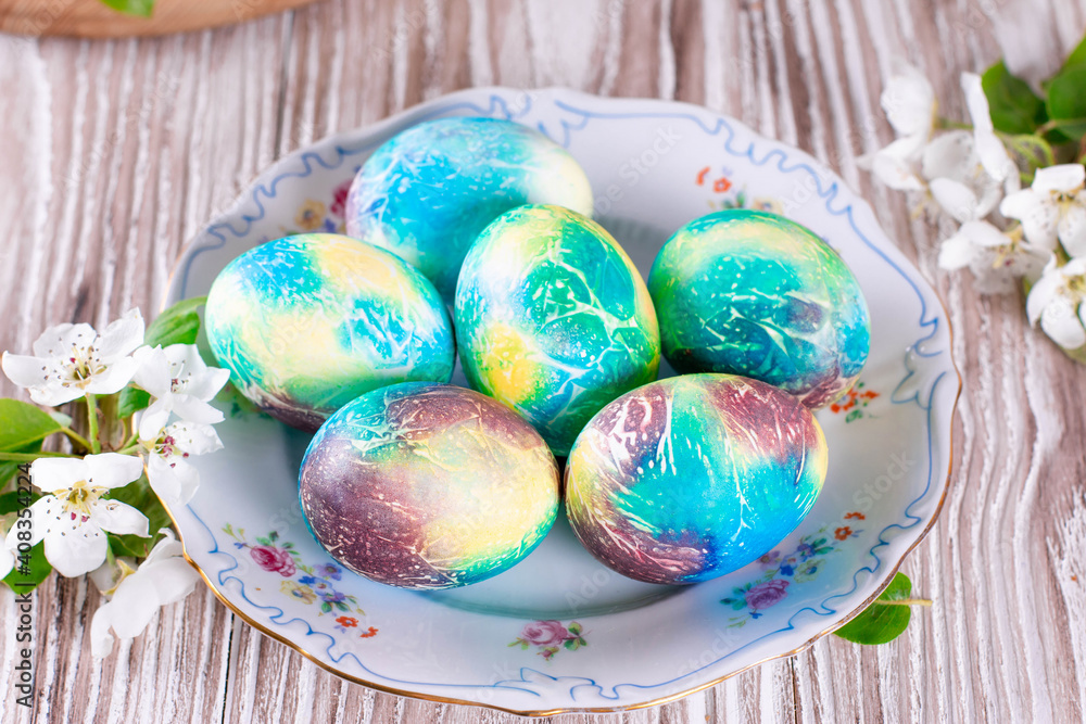 Easter. Colorful Easter eggs with spring blossom flowers Easter. Colorful Easter eggs with spring blossom flowers