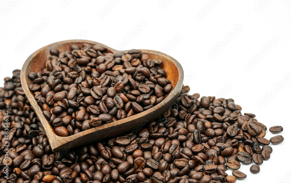 Coffee beans in wooden bowl on white background for valentines day concept.	
