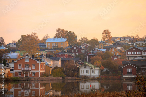 Beautiful panorama of the embankment rivers and urban architecture, colored houses, roofs and churches of the city of Porvoo in finland