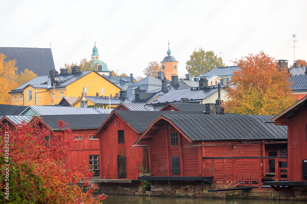 Beautiful panorama of the embankment
rivers and urban architecture, colored houses, roofs and churches of the city of Porvoo in finland