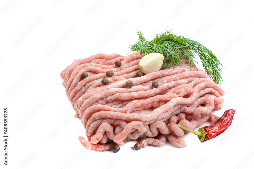 Fresh pork and beef minced meat, garnished with garlic, red pepper and dill.Isolated on a white background. Fresh pork and beef minced meat, garnished with garlic, red pepper and dill.Isolated on a white background.