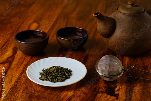 Green tea and teapot with bowls