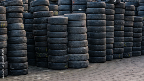 Used tire stacks in Workshop vulcanization yard in the city