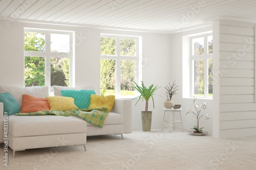 White living room with sofa and summer landscape in window. Scandinavian interior design. 3D illustration