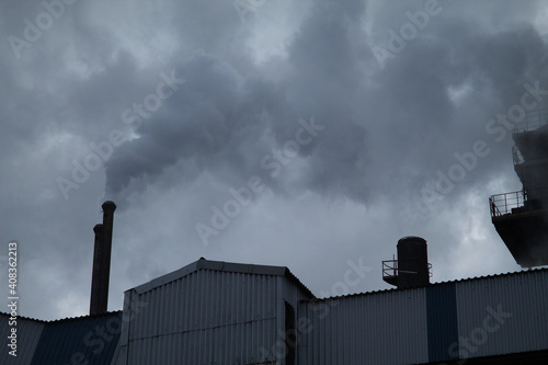 factory chimney venting fumes polluting the ozone layer