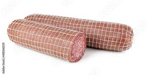 Traditional Italian Milano salami cut in a piece isolated against a white background. View from another angle in the portfolio.