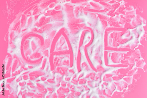 Fototapeta Naklejka Na Ścianę i Meble -  Washing concept. Soap foam on delicate pink background with copy space