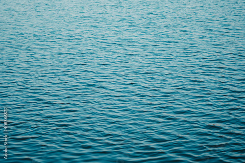 Full frame shot of rippled blue surface of water of lake