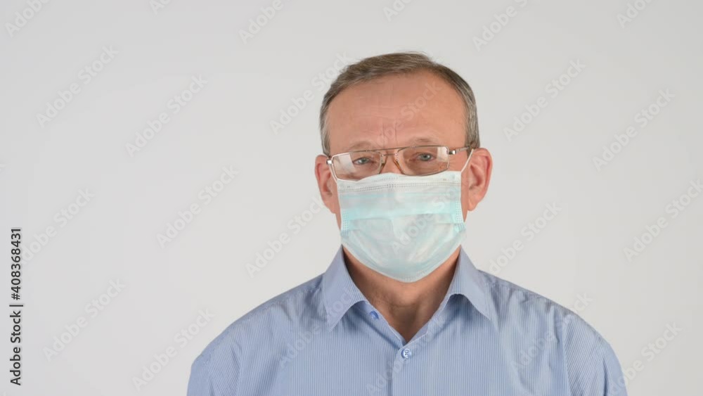 Portrait of elderly man in protective medical mask isolated on studio background. covid concept health and safety. Health care and medical. Portrait of elderly man in protective medical mask isolated on studio background. covid concept health and safety. Health care and medical.