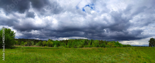 Before the rain. Idyllic rural scene. Atmospheric spring landscape.