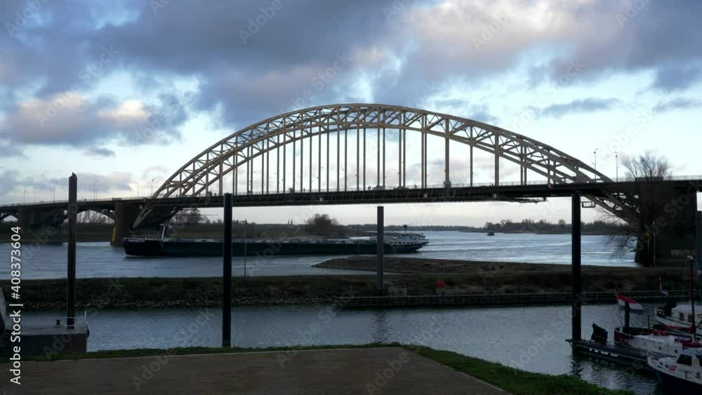 Iron bridge in nijmegen maritime traffic. Rhine river. Slow motion 4K Nijmegen 01/11/2021. Netherlands Iron bridge in nijmegen maritime traffic. Rhine river. Slow motion 4K Nijmegen 01/11/2021. Netherlands