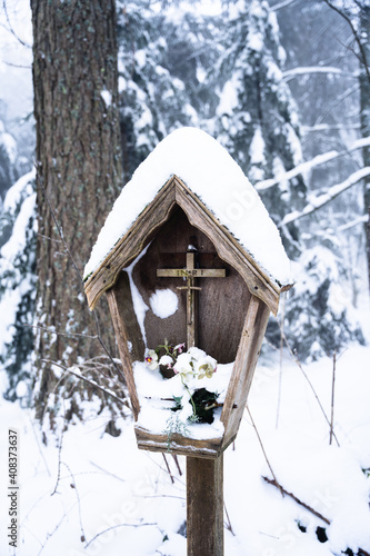Wayside cross covered in snow, Odenwald