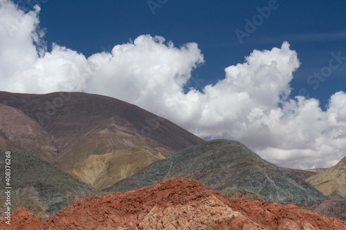 Altiplano. Colorful hills under a beautiful sky. View of the mineral and rocky mountains in the arid desert.