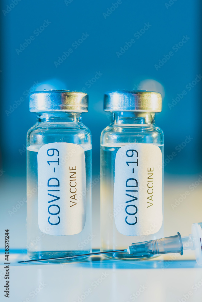 COVID-19 coronavirus vaccine. Ampoule and syringe close-up. Concept COVID-19 coronavirus vaccine. Ampoule and syringe close-up. Concept