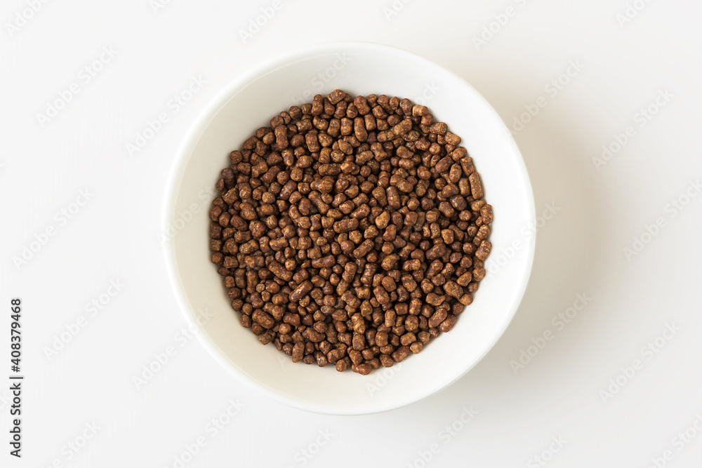 Buckwheat tea in a white bowl on a white background. Top view. Buckwheat tea in a white bowl on a white background. Top view.