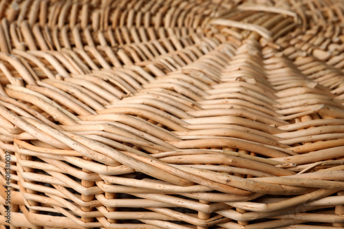 Lid of handmade wicker basket as background, closeup