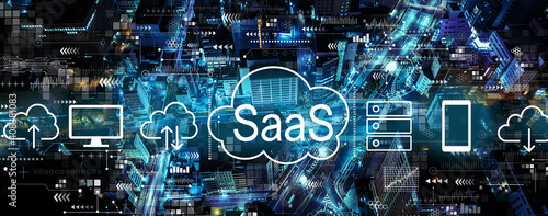 SaaS - software as a service concept with aerial view of urban city at night