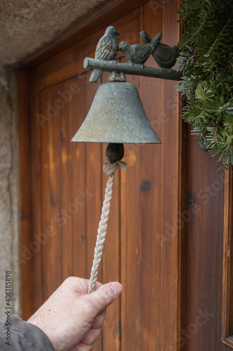 Person Ringing At Old Doorbell