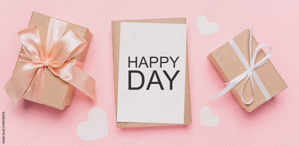 Gifts with note letter on isolated pink background, love and valentine concept with text happy day