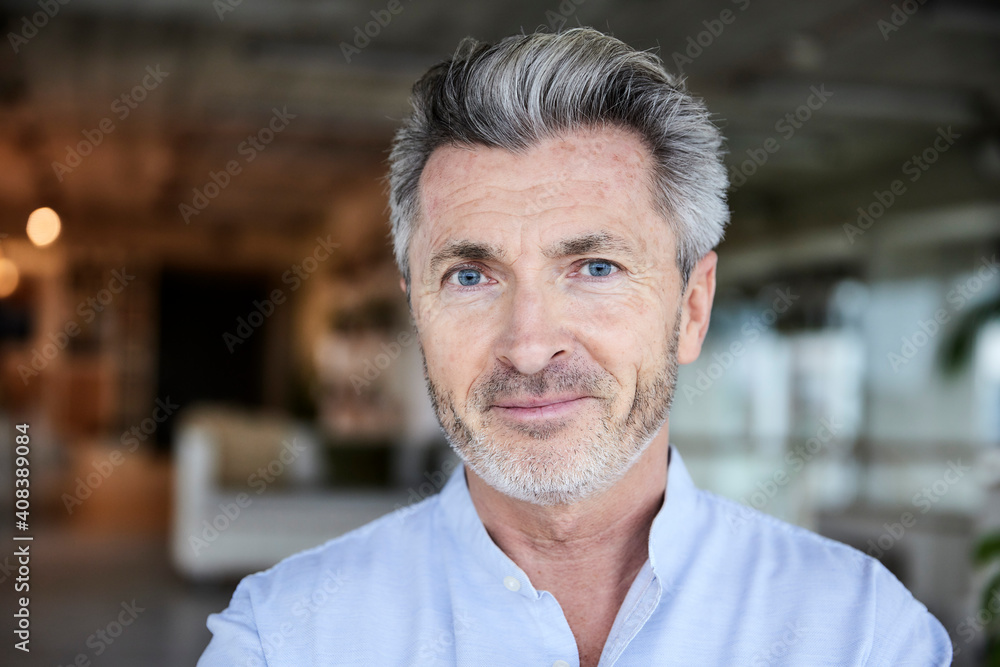 Smiling businessman with blue eyes Smiling businessman with blue eyes