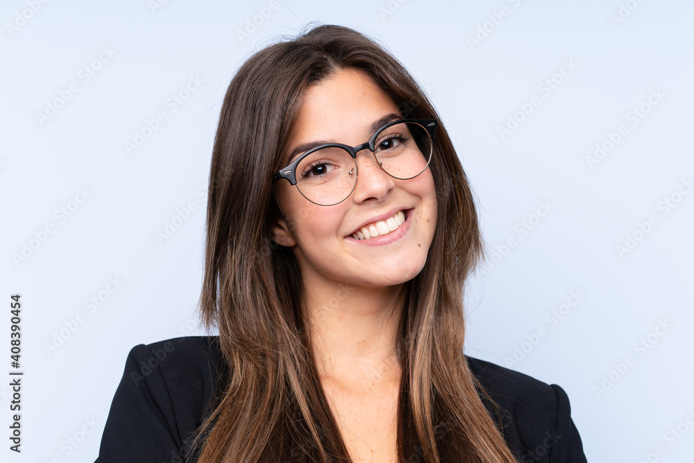 Teenager Brazilian girl with glasses over isolated background