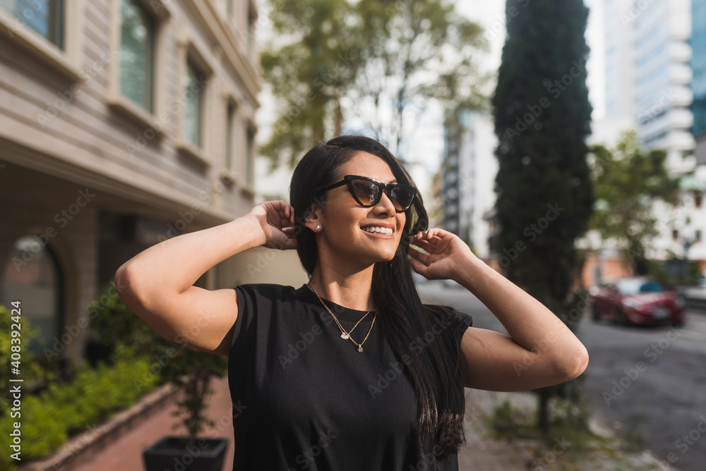Attractive woman looking away in city