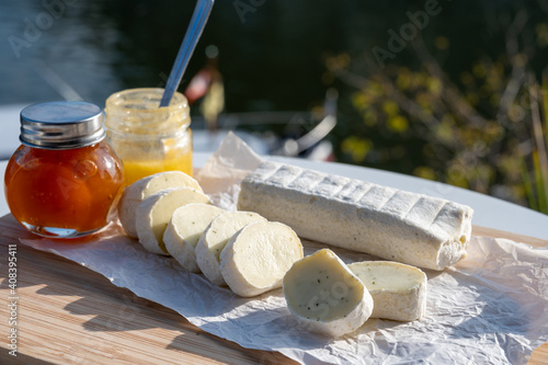 Belgian abbey cheese fagotin in pieces with jam served outdoor, Wallonia, Belgium photo