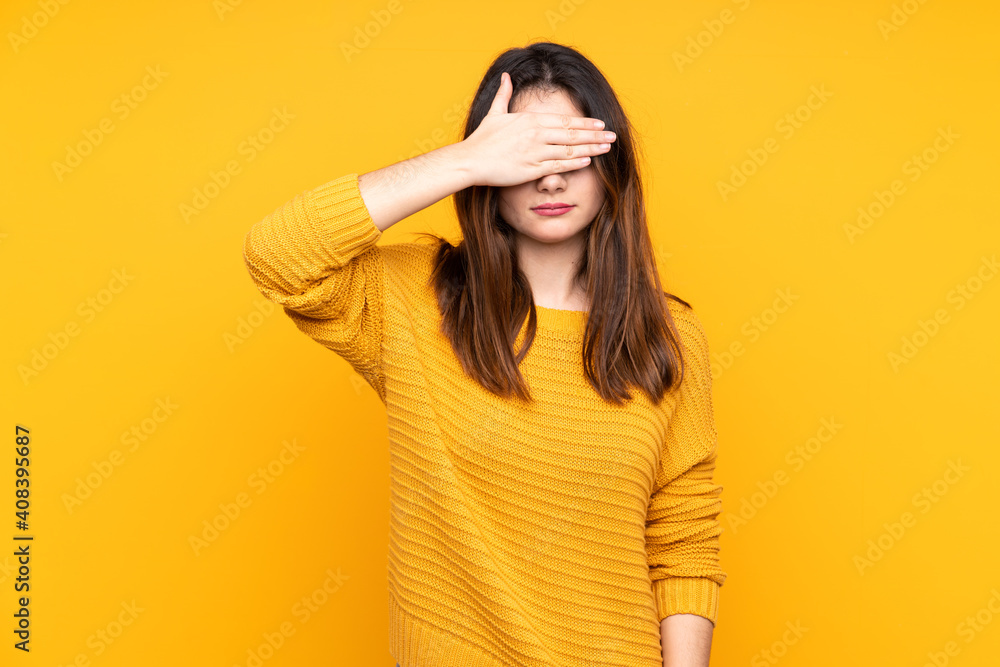Young caucasian woman isolated on yellow background covering eyes by hands. Do not want to see something Young caucasian woman isolated on yellow background covering eyes by hands. Do not want to see something