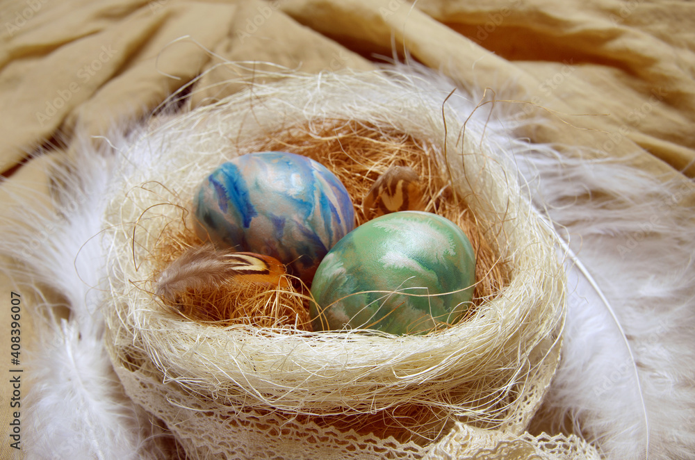 Ostara symbols. Colorized eggs in a nest. Stock Photo | Adobe Stock