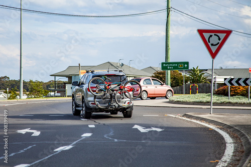 Cars driving around a roundabout photo