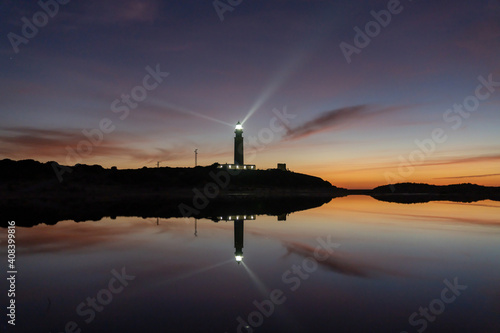 the Cape Trafalgar lighthouse signal light after sunset with colorful evening sky