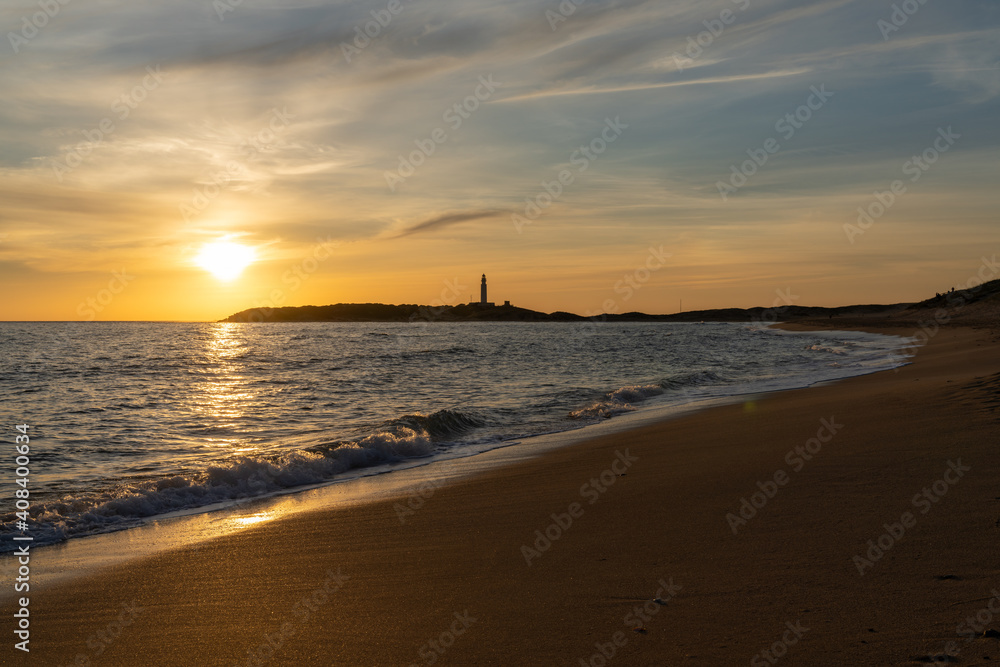 sunset on the Playa de Maria Sucia Beach with the Cape Trafalgar Lighthouse in the background