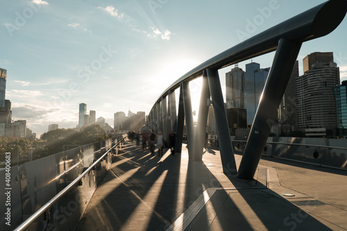 Sunlight shining through architecture with blurred people, Birrarung Marr photo