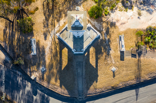 Aerial view over the top of a lookout tower on a hill top. photo