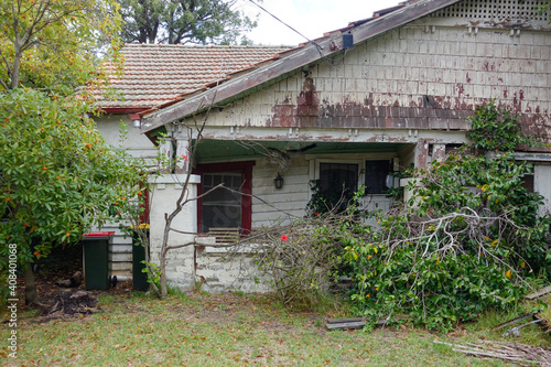 Old weatherboard house collapsing and in disrepair