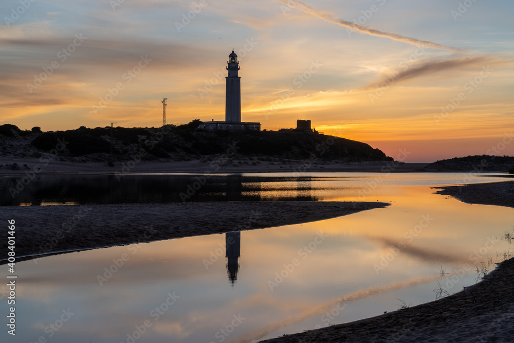 the Cape Trafalgar lighthouse after sunset with colorful evening sky