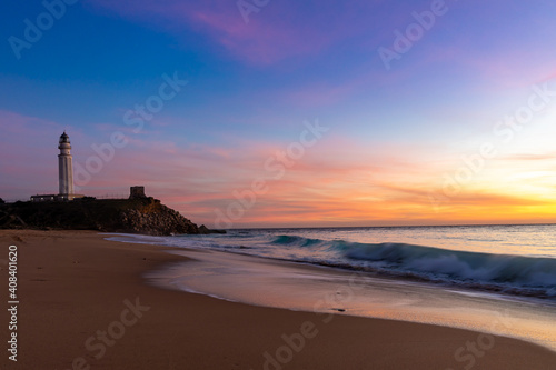 the Cape Trafalgar lighthouse after sunset with colorful evening sky