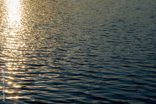 Golden sun reflection in water