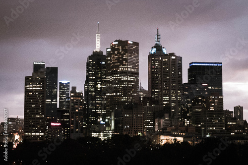 view of Melbourne city scape at night in a purple lit sky photo