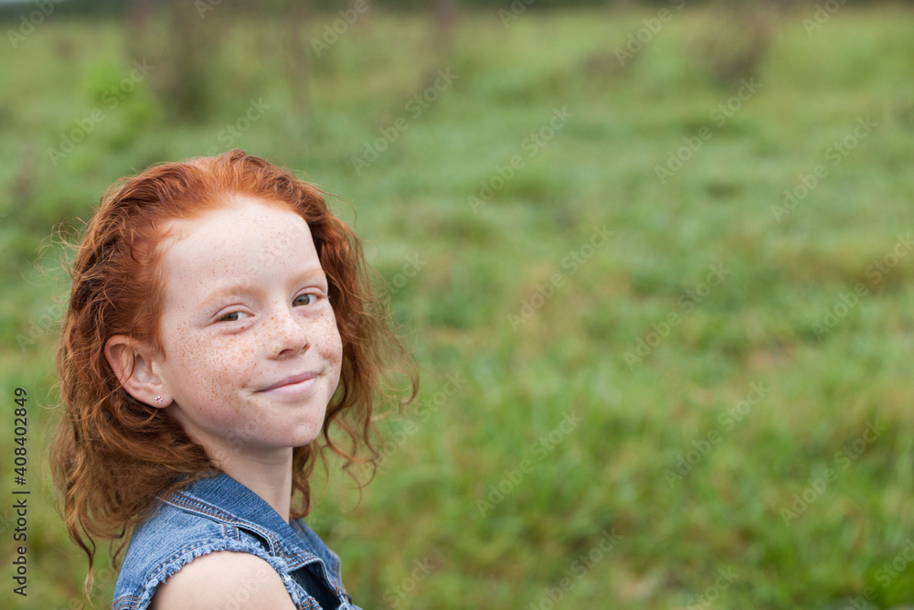 Close up of a young redhead girl smiling Close up of a young redhead girl smiling