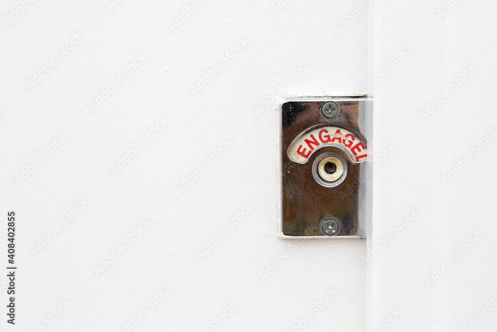 Red engaged sign turned on in public toilet Red engaged sign turned on in public toilet