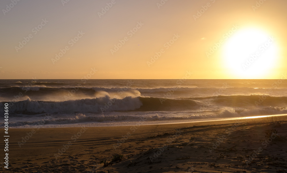 Running waves at the Praia de Faro , Portugal Running waves at the Praia de Faro , Portugal