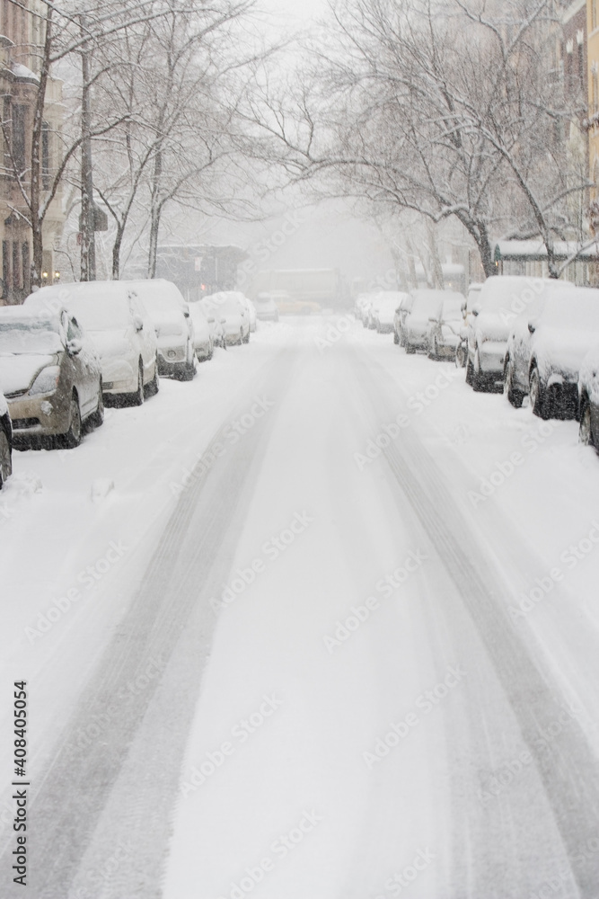 USA, New York City, snowy street with rows of parked cars USA, New York City, snowy street with rows of parked cars