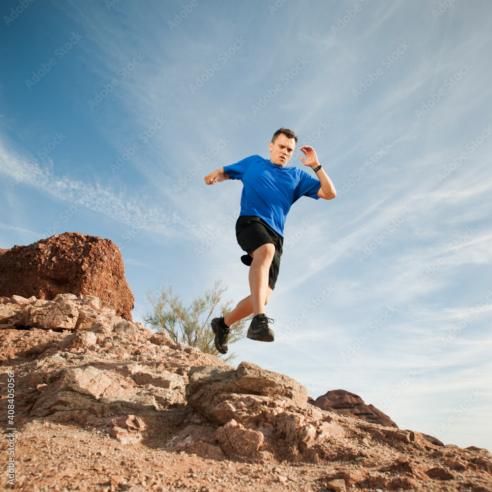 USA, Arizona, Phoenix, Mid adult man jogging on desert USA, Arizona, Phoenix, Mid adult man jogging on desert