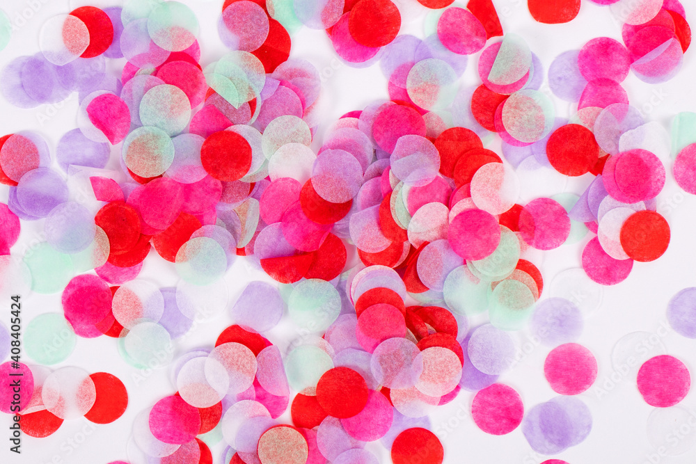 Bright background from colored confetti. Photography for design. Festive texture for design.