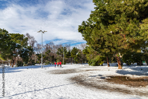 central zone of the O'Donnell park in alcala de henares covered with snow on a sunny day after a snowfall